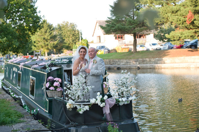 Bride and groom on a cannel boat